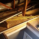 The yellow cables should be at least six feet from the side of the attic scuttle hole in all directions if installed this way. Code allows exceptions to this, but they are labor intensive.